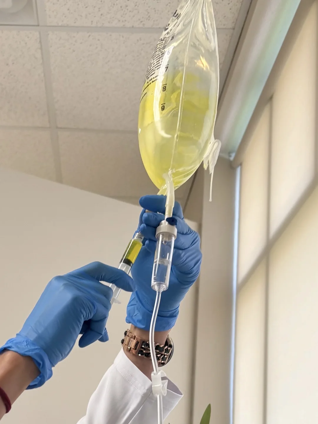 Clinician preparing an IV bag at Bambu Recovery