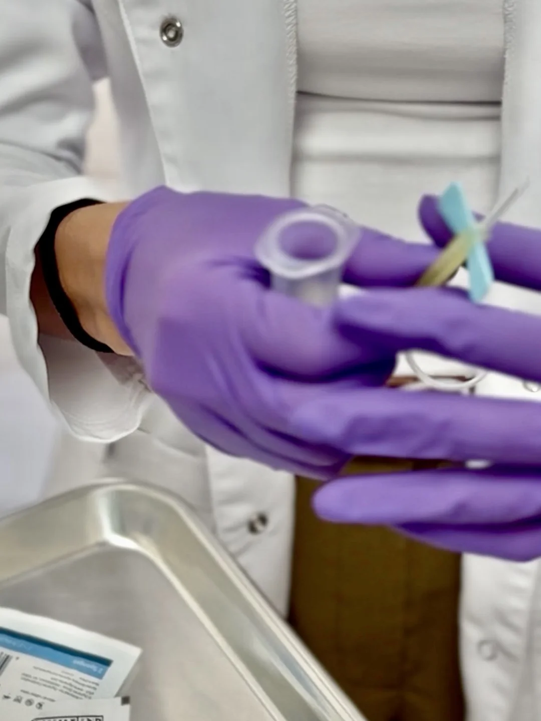 Preparing a blood collection tube for pre-op labs at Bambu Recovery